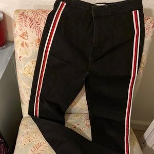 Black skinny jeans with red and white detailing